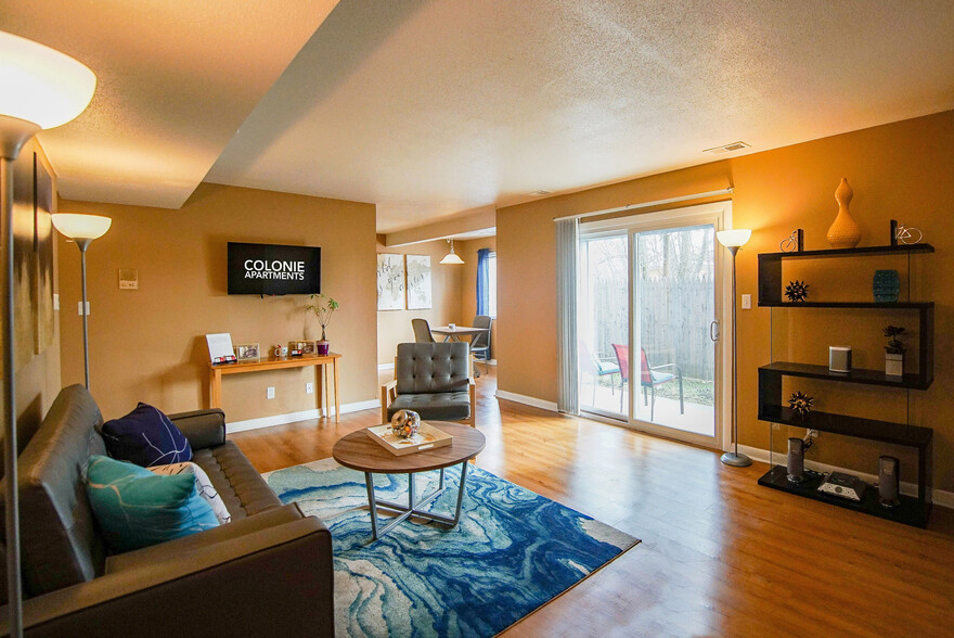 Living Room & Private Balcony - Colonie Apartments