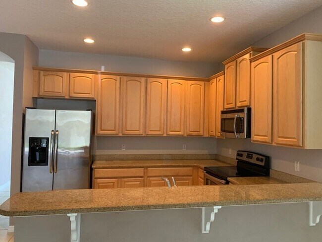 Building Photo - Beautiful 4/2 home in Lovely Venetian Bay ...