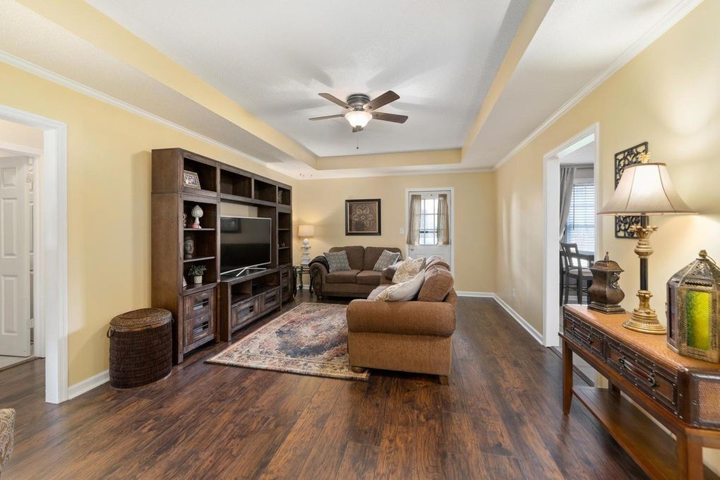Living room with tray ceiling & entrance to back deck - 1102 Tobacco Rd