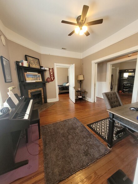 View from bathroom door into Back Parlor/Dining w view into back Bedroom, Hall, & Front Parlor/Livin - 1217 Java Pl