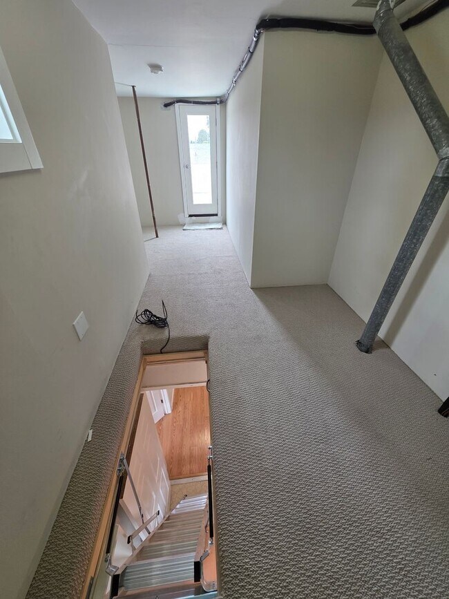 Building Photo - Spacious 2BR Condo with Central A/C, Bonus Room & Huge Storage – Walk to Burlingame Avenue
