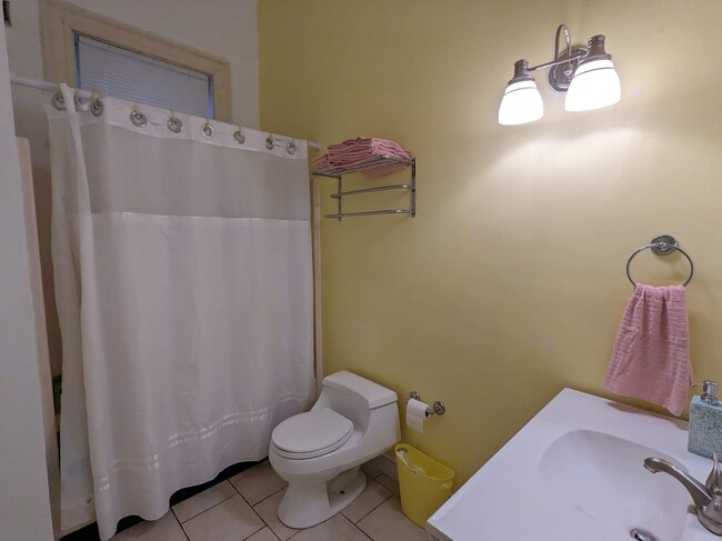 The bathroom is simple but clean. - 1816 W Grace St