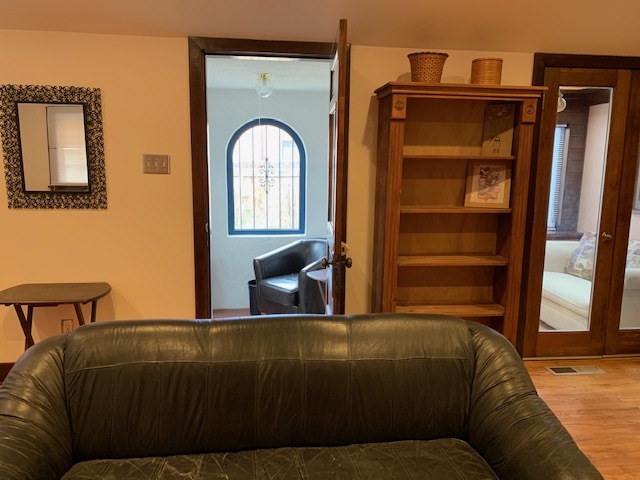 Door to small sun room with small sleeper sofa - 412 Carlisle Blvd NE