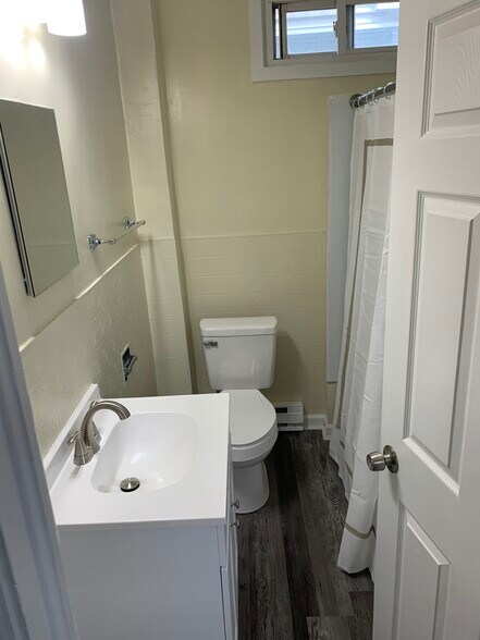 new floor, sink & toilet - has a full linen closet in bathroom - 1216 W Norwegian St