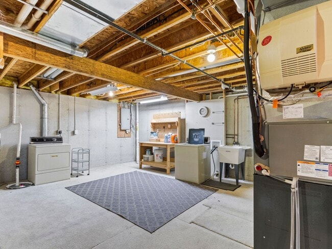 Building Photo - Spacious 3BR/3BA Condo with Finished Basement + 2-Car Garage — Available Now