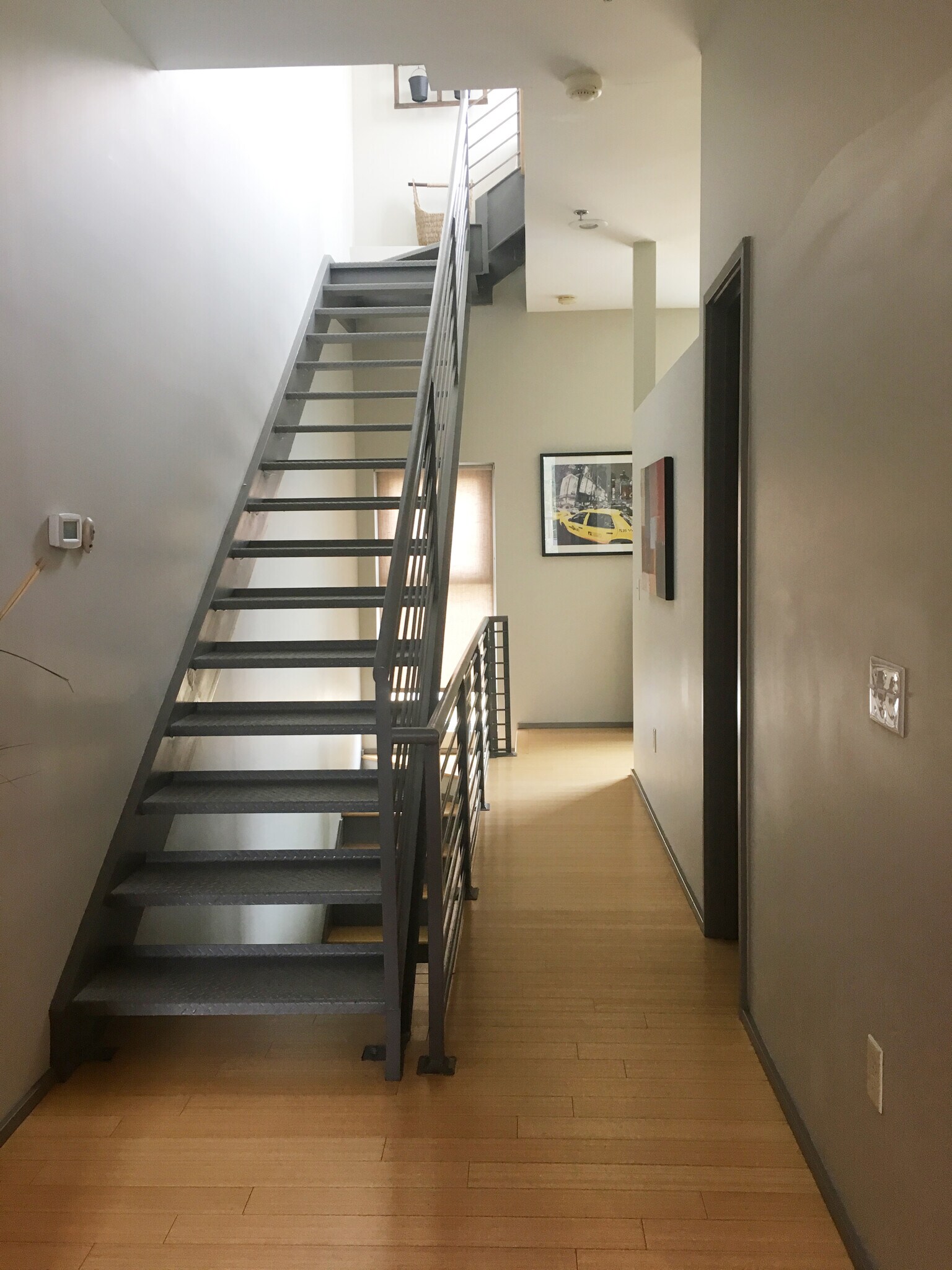 Steel staircase leads to the rooftop patio. - 2074 Euclid Ave