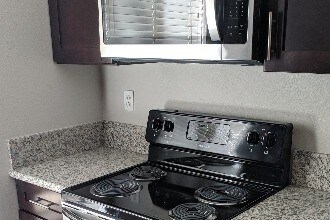 Stainless steel range and microwave - 3106 Summertime Ln