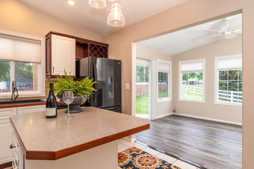 Kitchen open to North Sunroom - 197 Johnson Dr