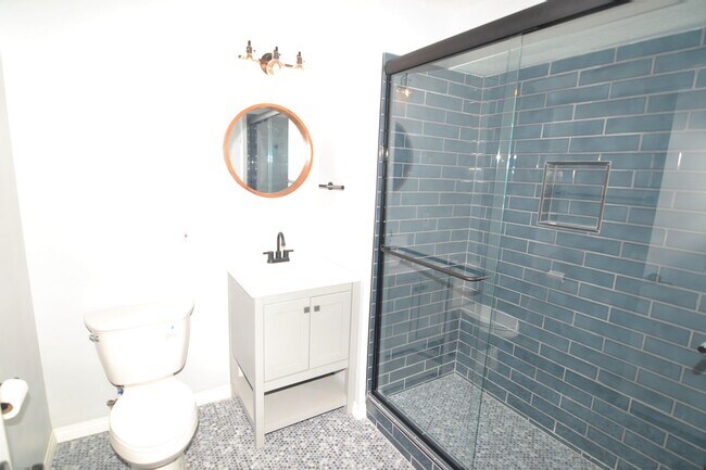 Building Photo - Spacious Lower Level Condo with all the Am...