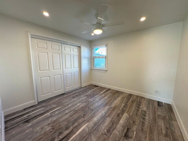 Building Photo - RENOVATED 3 bedroom end unit across the street from the Beach!