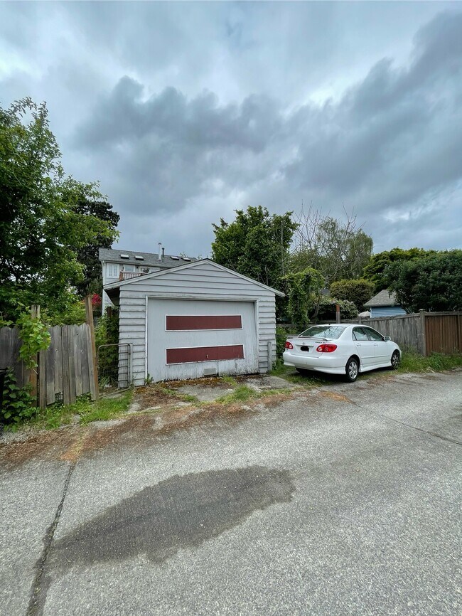 Dedicated parking spot on alley. Private entrance to apartment from back yardof home. - 8310 Stone Ave N