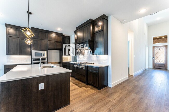 Building Photo - Highly Upgraded Five-Bedroom Home Located ...