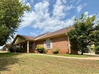 Building Photo - You will LOVE the fenced yard!