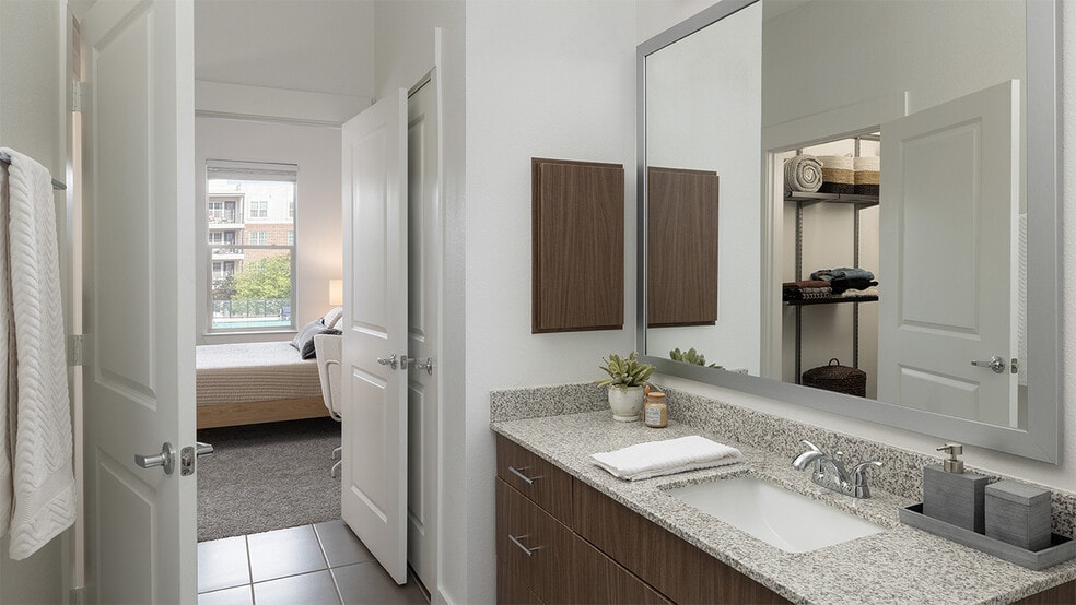 Apartment Bathroom with spacious closet and tile flooring. - Griffis Oak Lawn