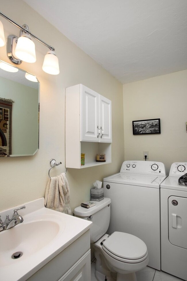 Building Photo - 3 Bedroom 1 bath and 2 half Baths with a g...