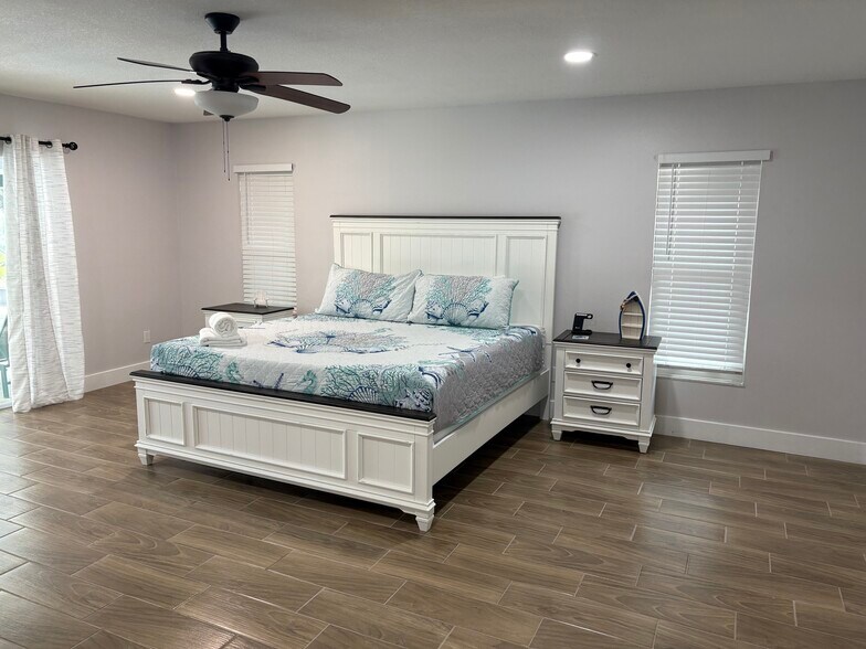 Bedroom #1 with King bed and private bathroom - 11936 W Waterway Dr