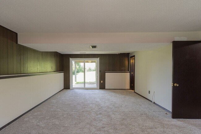 Building Photo - Charming 3BR Home-Screened Porch, Private Garage & Massive Backyard