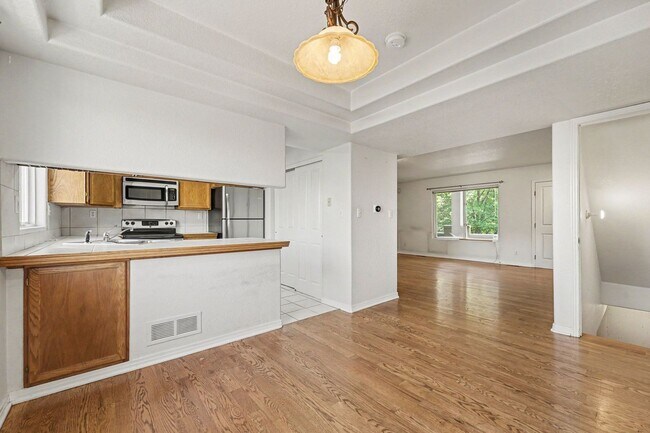 Building Photo - Beautiful 2BR Townhome in Gated Community with 2-Car Garage