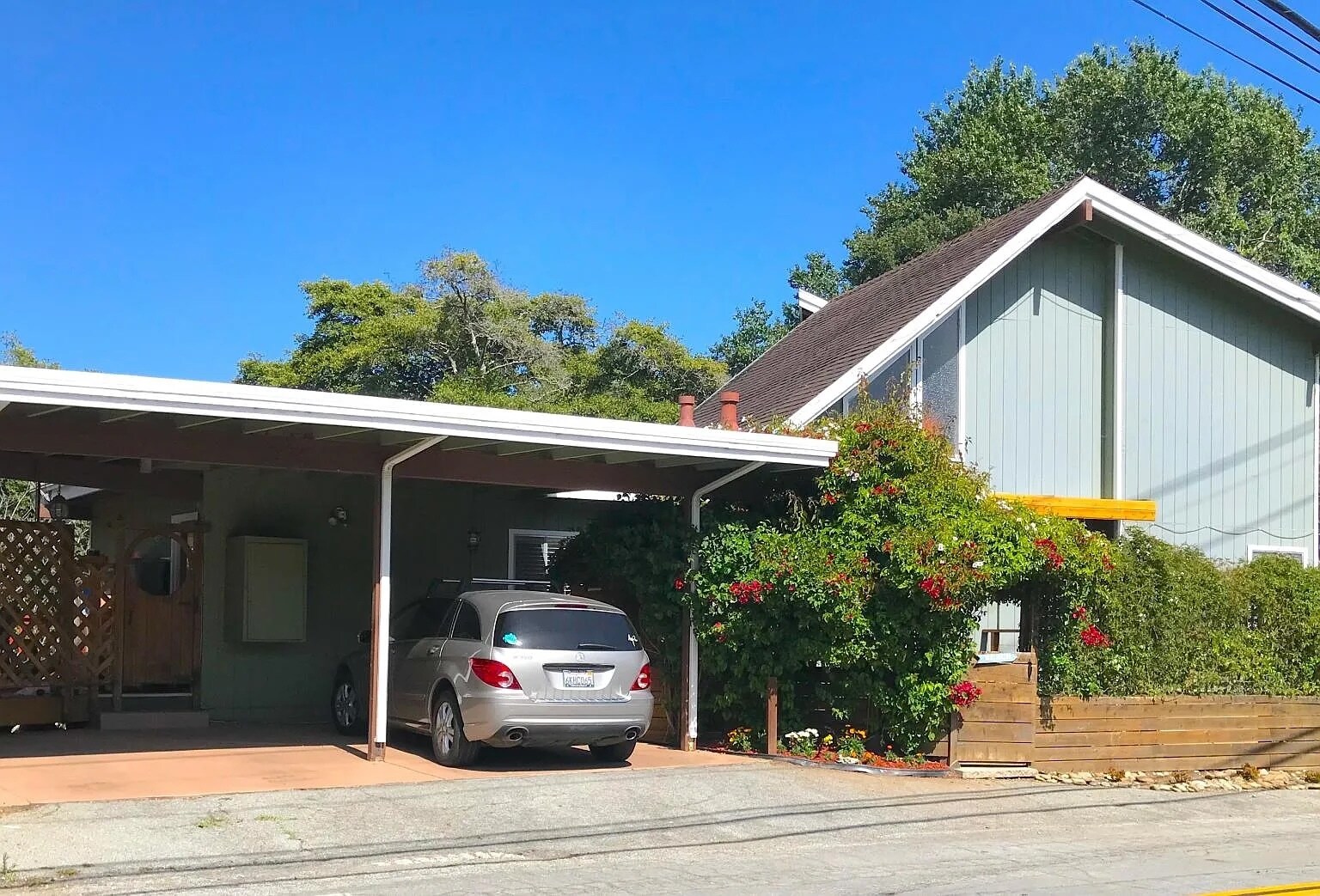 Exterior with flower vines, carport and storage shed - optional hot tub spa on stone patio - 3560 Paper Mill Rd