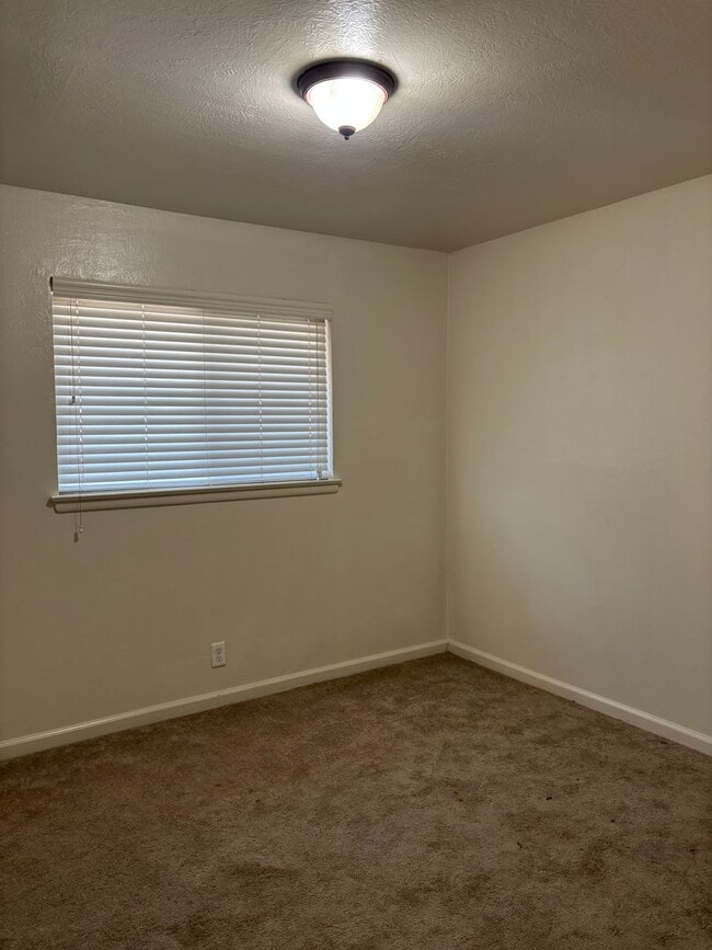 Building Photo - Updated 3 bedroom 2 bathroom home with large backyard, corner lot, close to shopping and schools ...