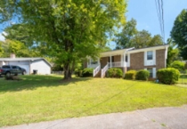 Building Photo - This beautifully updated brick home in Har...