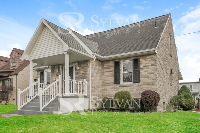 Building Photo - You will love this adorable brick home