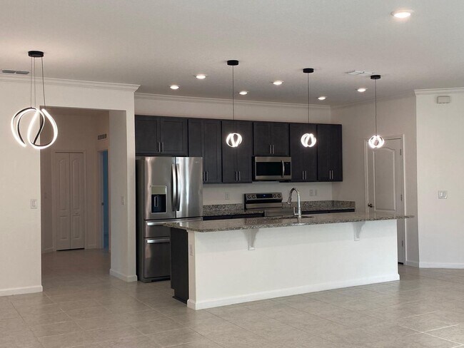 Building Photo - Like New 3 bedroom + den with French doors, screened in porch and Fenced yard and much more...