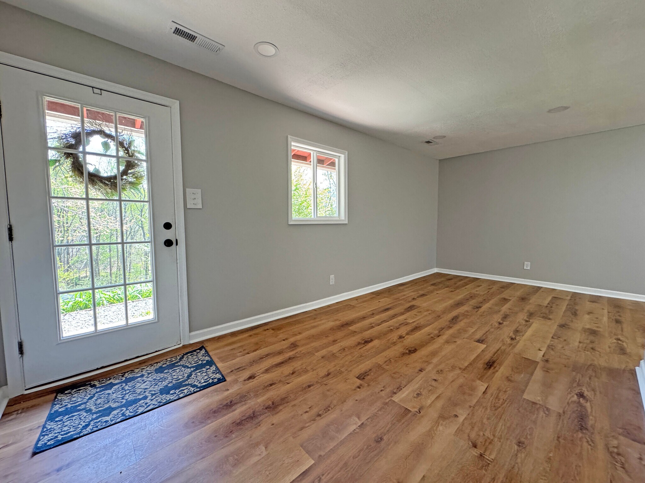 Living Room - Home has Heat Pump, Energy Efficient Windows, and Luxury Vinyl Plank Flooring - 7942 New Hope Rd