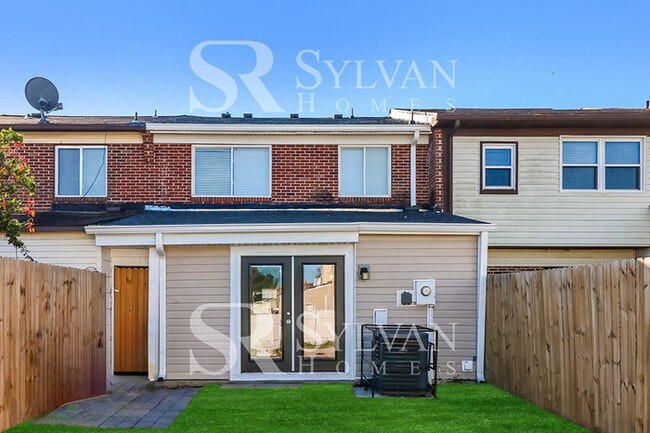 Building Photo - Venture outside to the expansive backyard,...