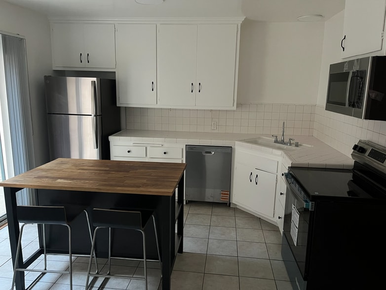 Kitchen with new appliances - 8315 W Manchester Ave