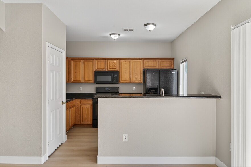 Building Photo - 6321 Blowing Sky St