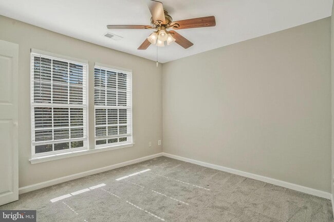 Building Photo - This beautifully maintained brick-front, three-level townhome is located in a highly sought-after...