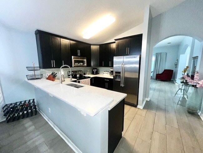 Building Photo - Lake Nona!! Spectacular 4X2 in Gated Nona Crest! All tile flooring!! 2 car garage! Move in April ...