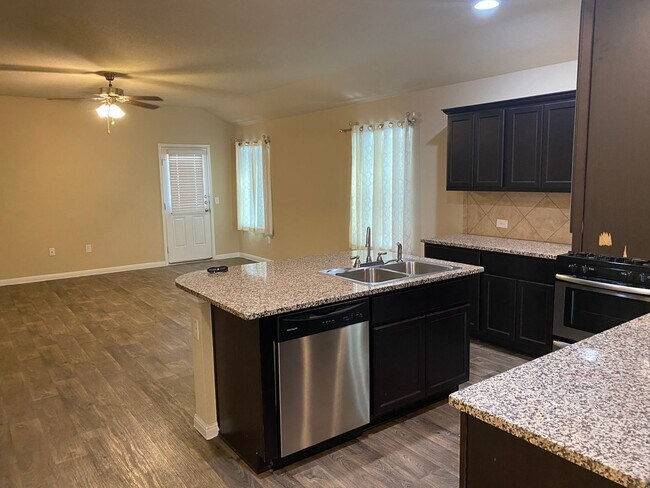 Building Photo - Three Bedroom, Two Bath, Two Car Garage, Washer and Dryer are included.