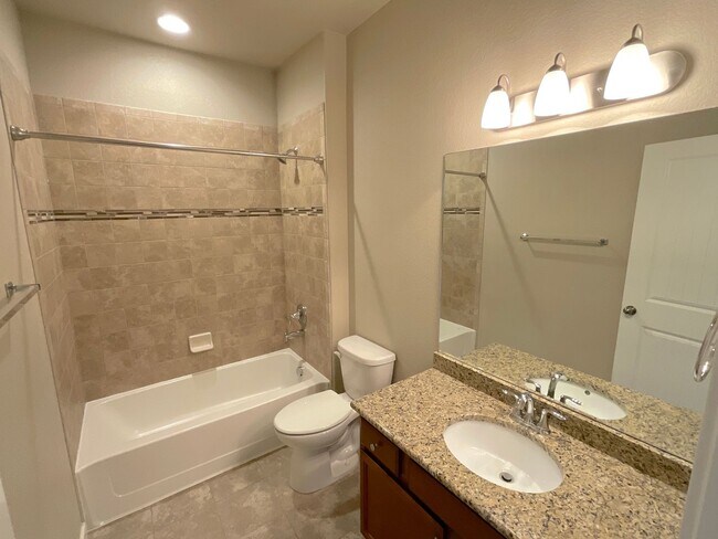 Building Photo - 4 Bedroom Home Available Near Woodmoor Dr ...