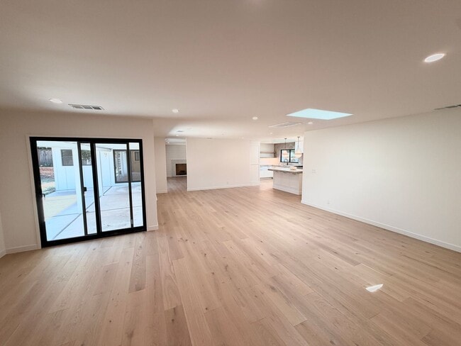 Building Photo - This premier 4-bed, 3-bath estate spans 2,565 sq. ft. on a 10,253 sq. ft. lot in North Los Altos.