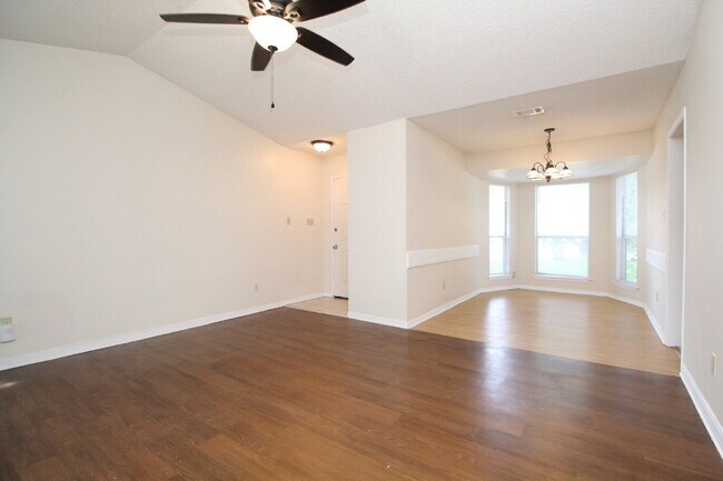 Building Photo - 2BR Home with Wood-Look Flooring, Fenced Backyard & Private Patio