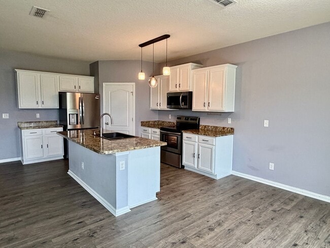 Building Photo - Spacious 5 Bedroom, 3 Bathroom Home with Flex Room, Loft & Pond View