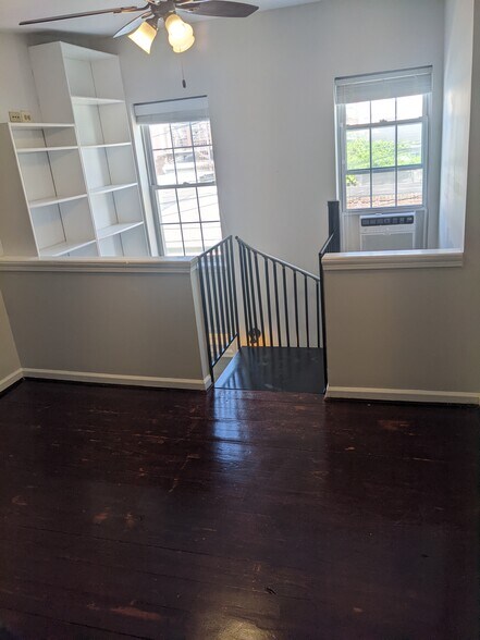 built in bookshelves extend two stories - 1528 Olive St