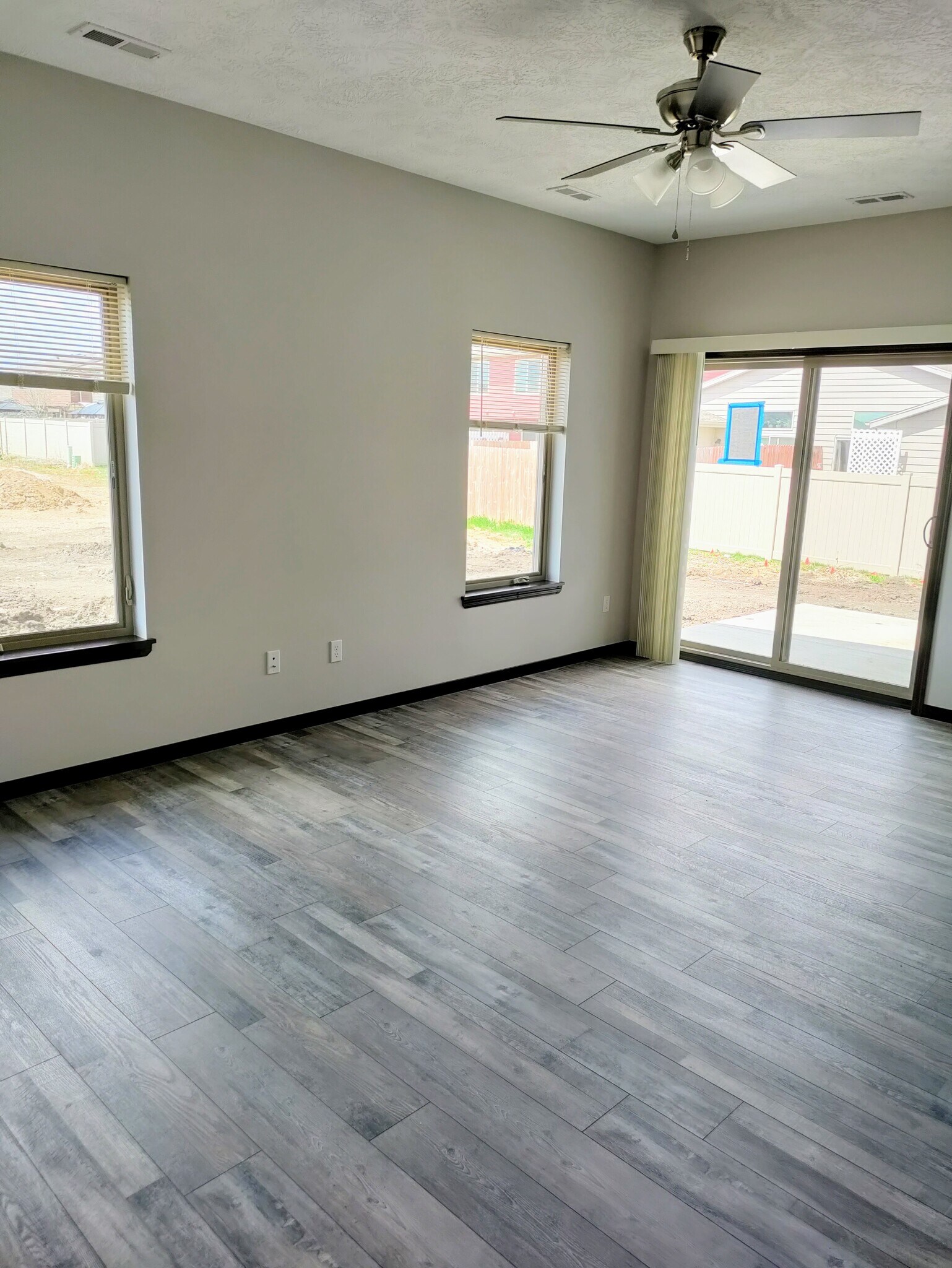 Living room with sliders to patio - 9402 W Dolores Dr