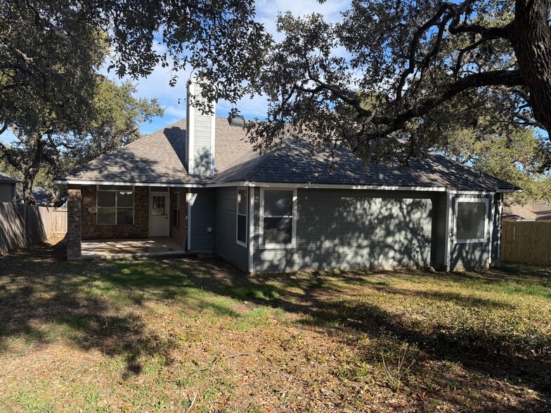 backyard facing house - 8107 Valley Trl