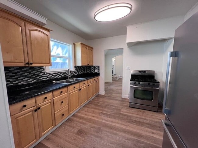 Building Photo - Beautiful Land Park home with fresh paint and new flooring throughout.