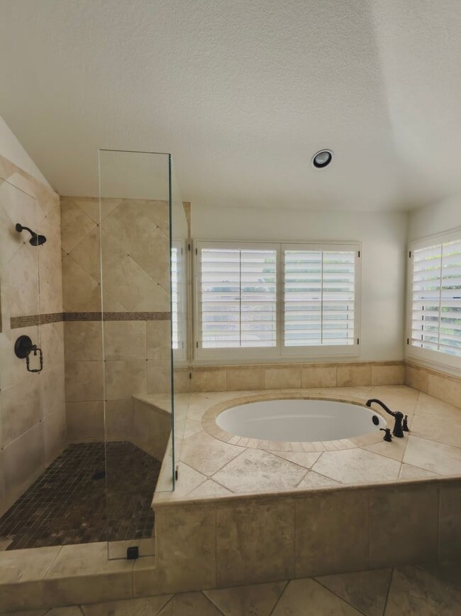 Building Photo - Elegant Mediterranean Living with Private Pergola Garden & Resort Amenities