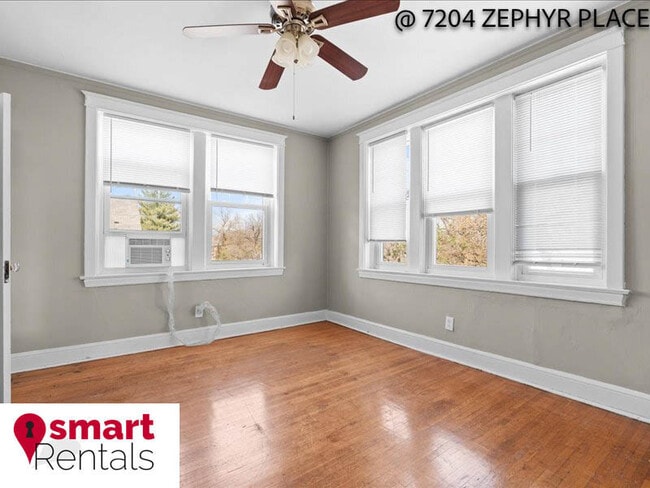 Building Photo - 7204 Zephyr Place - 2E