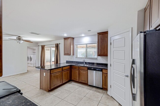 Building Photo - Spacious & Stylish 4/2 – Just  2 Miles fro...