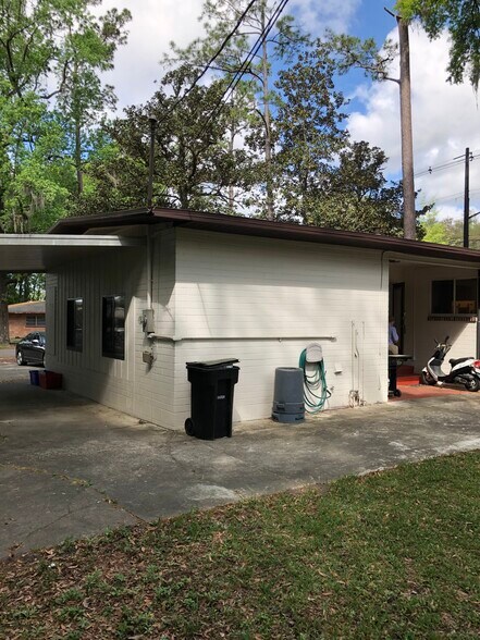 Back entrance with covered patio - 3125 W University Ave