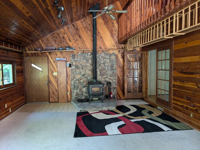 Fireplace and sunroom with hot tub - 28 James Circle