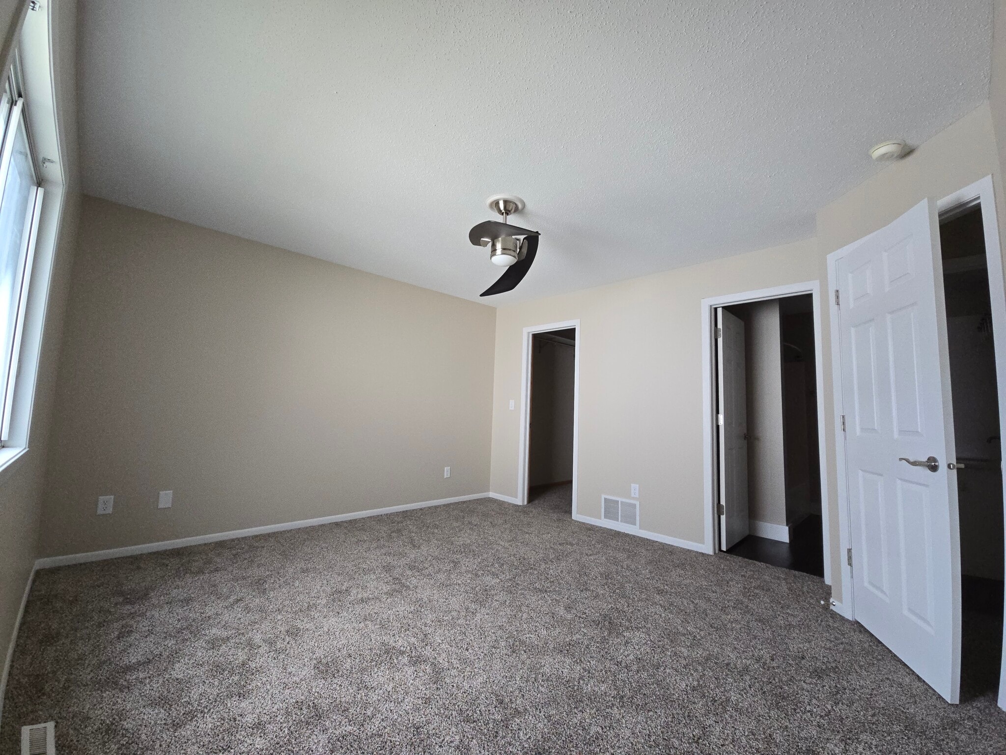 Master Bedroom with ceiling fan - 994 38 1/2 Ave W
