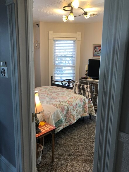 Smaller bedroom has many windows. - 1216 Central Ave