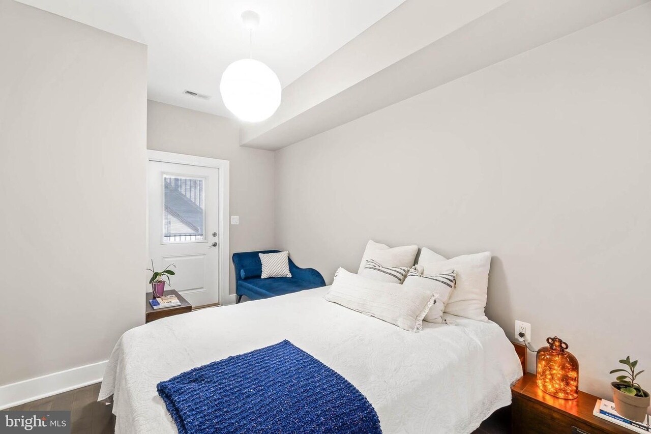 This bedroom offers direct access to the back porch. It has a full closet with hanging racks - 3821 14th St NW